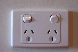 An image depicting Type 1 power sockets for Australia. Iamage is File:Mains-AU-10A-household2.JPG by User:Nonvolatil on Wikimedia Commons. CC-BY-SA 2.5